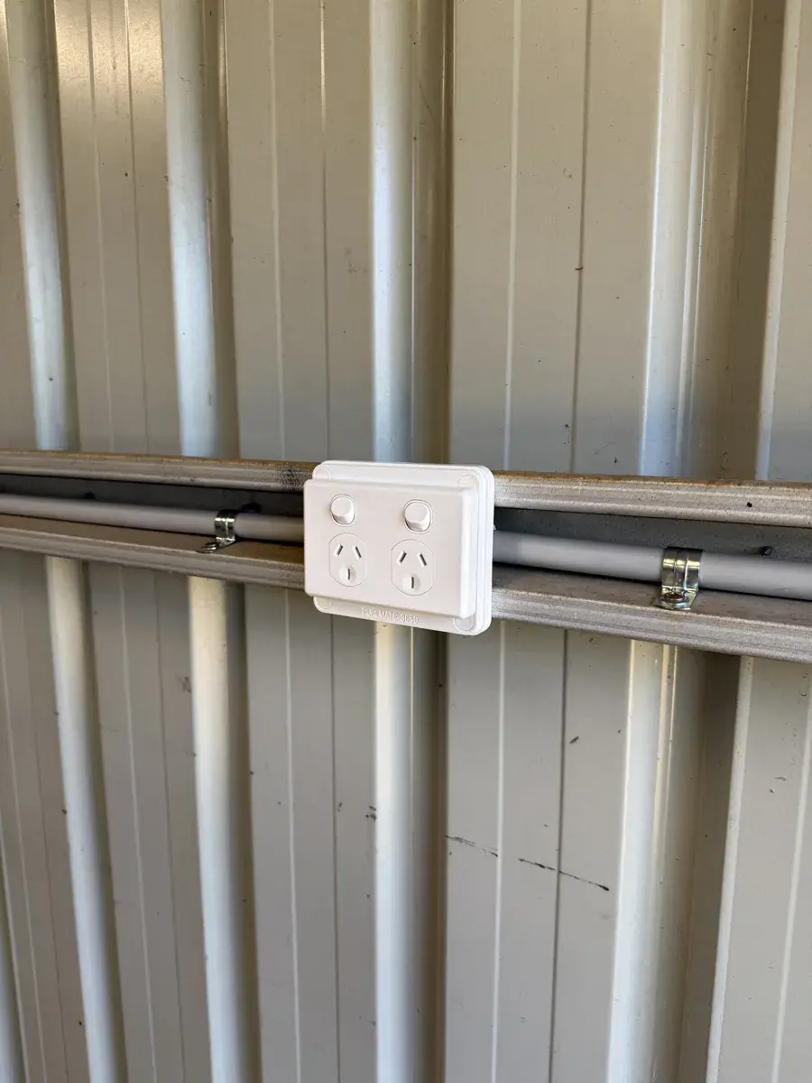 Weatherproof double power point with surface conduit in Colorbond shed